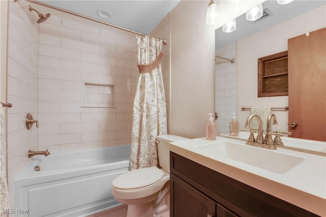 bathroom with visible vents, toilet, vanity, and shower / bath combination with curtain