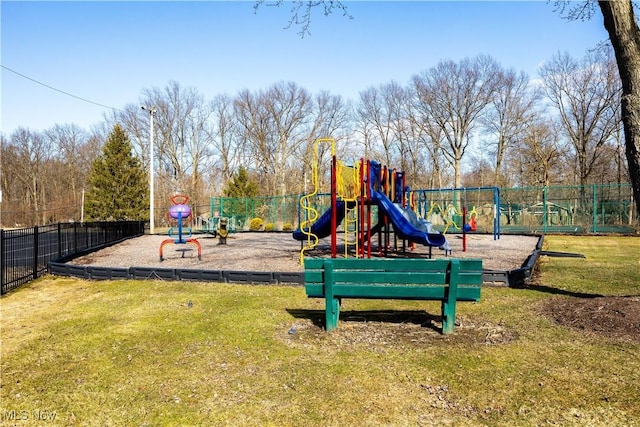 community playground with a lawn and fence