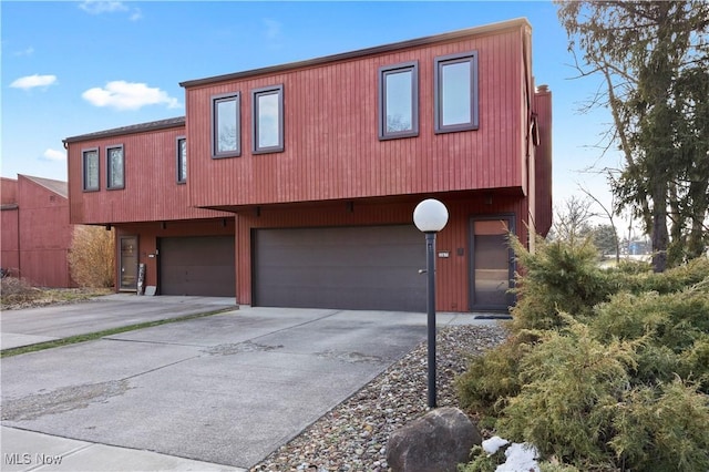 view of front of house with an attached garage and concrete driveway