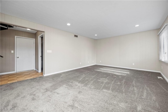 unfurnished room featuring recessed lighting, visible vents, baseboards, and carpet