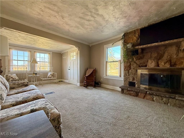 unfurnished living room with visible vents, crown molding, baseboards, carpet, and a textured ceiling