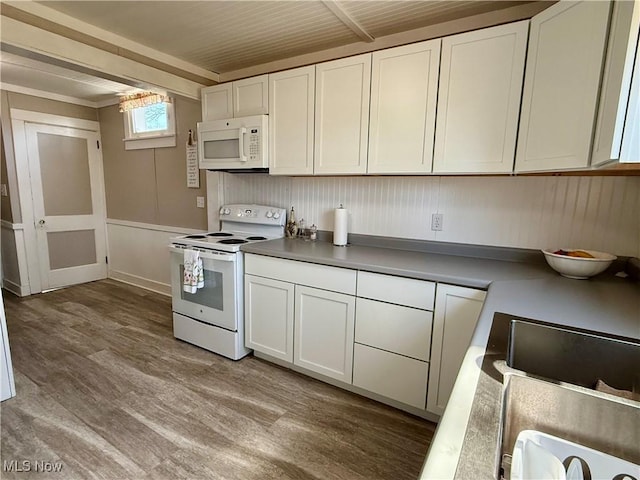 kitchen featuring white cabinetry, white appliances, and wood finished floors