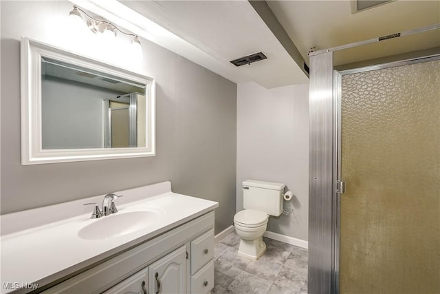 bathroom featuring visible vents, a stall shower, toilet, and vanity