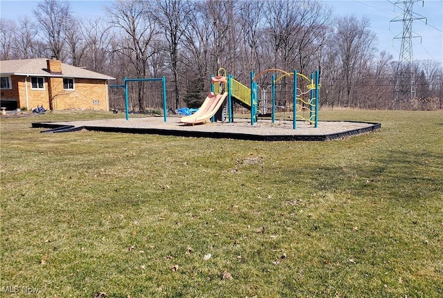 communal playground featuring a yard