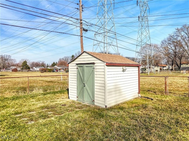 view of shed with fence