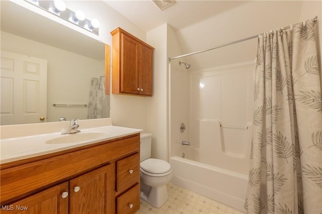 full bathroom with vanity, shower / bathtub combination with curtain, visible vents, tile patterned floors, and toilet