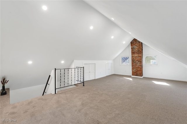 bonus room with vaulted ceiling, baseboards, and carpet floors