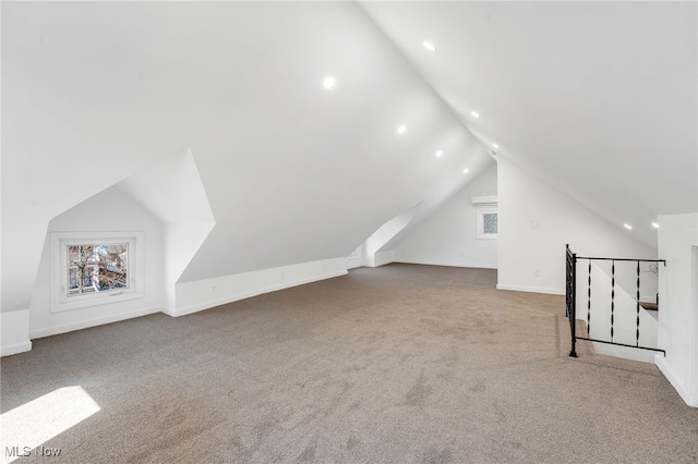 additional living space featuring visible vents, lofted ceiling, recessed lighting, carpet, and baseboards