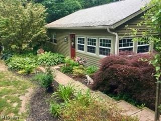 view of front facade featuring a vegetable garden