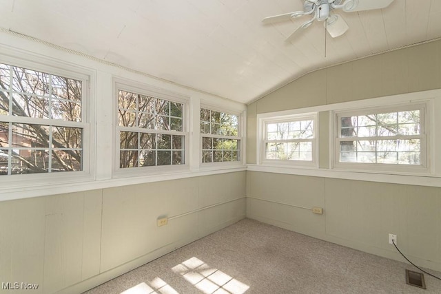 unfurnished sunroom with visible vents, a ceiling fan, and lofted ceiling