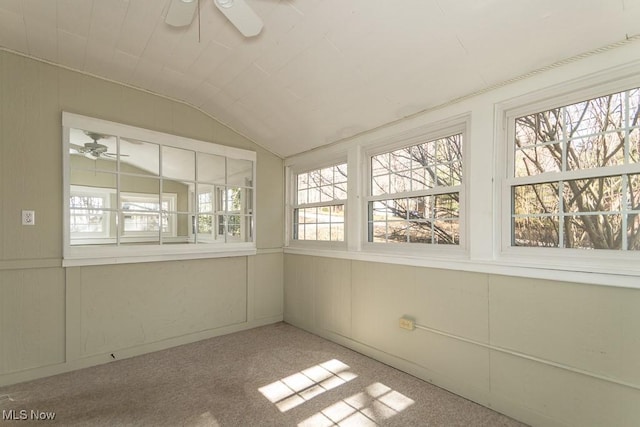 unfurnished sunroom with lofted ceiling and a ceiling fan