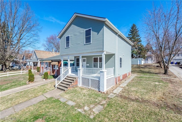 view of front facade with a porch and a front yard