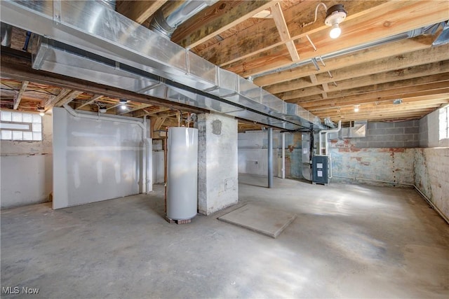 below grade area featuring gas water heater and heating unit