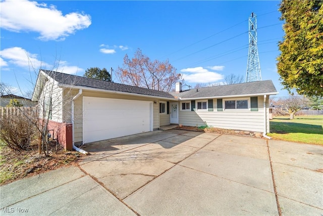 ranch-style house featuring driveway and a garage