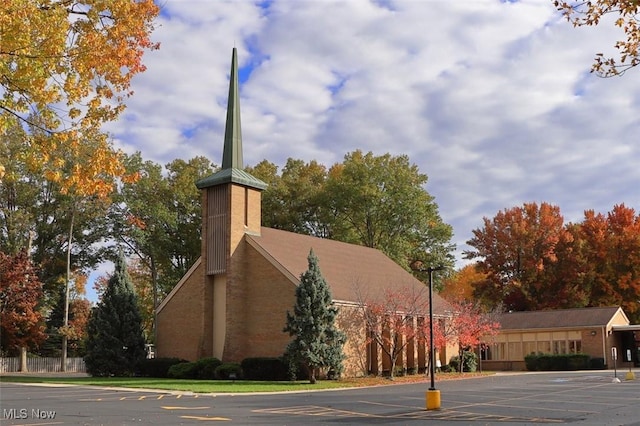 view of property with uncovered parking