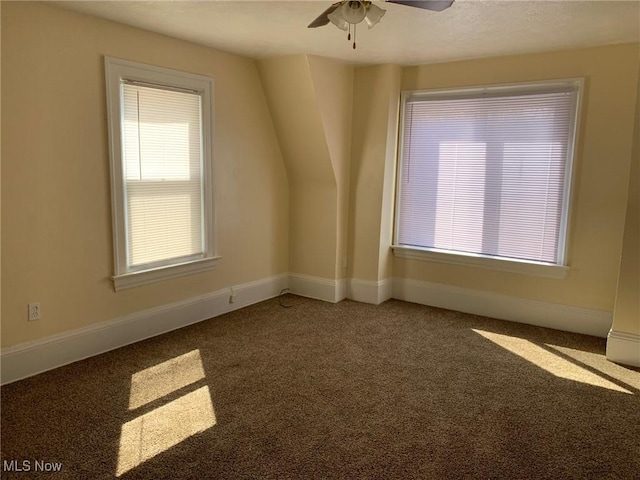 additional living space with carpet flooring, baseboards, and ceiling fan