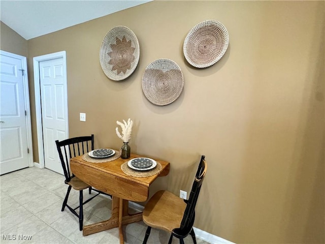 dining space featuring baseboards