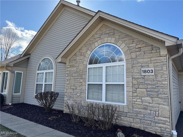 view of home's exterior featuring stone siding