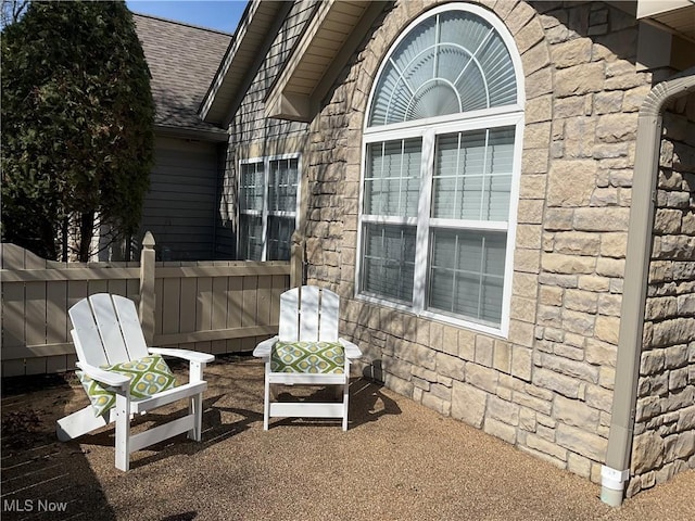 view of patio / terrace with area for grilling and fence