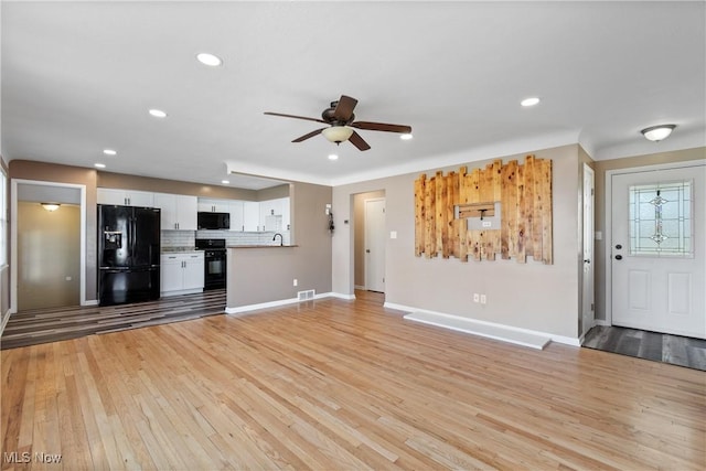 unfurnished living room featuring visible vents, baseboards, recessed lighting, light wood-style flooring, and a ceiling fan