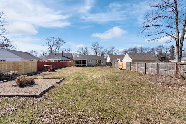 view of yard featuring a fenced backyard