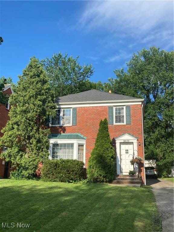 3633 Ingleside Rd, Shaker Heights, OH 44122 - colonial-style house with a front yard and brick siding