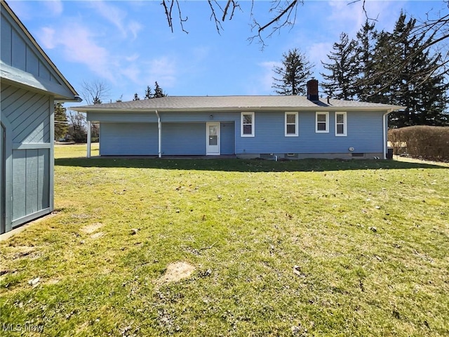 view of front of house featuring a front yard and a chimney