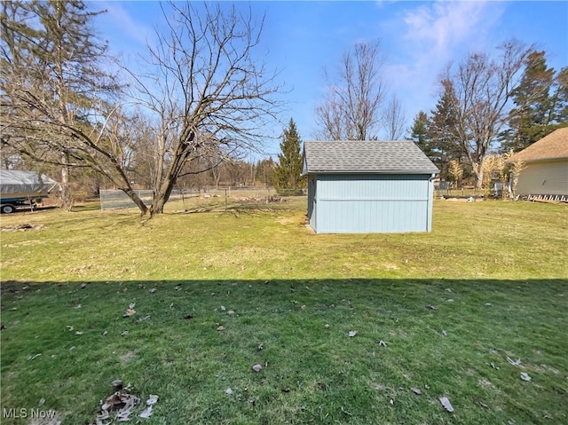 view of yard with an outbuilding and a storage shed