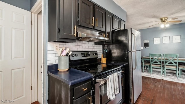 kitchen featuring tasteful backsplash, ceiling fan, under cabinet range hood, stainless steel range with electric cooktop, and a textured ceiling