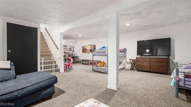 playroom featuring recessed lighting, carpet floors, and a textured ceiling