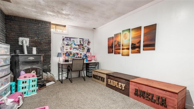 recreation room featuring a textured ceiling, a wood stove, and carpet