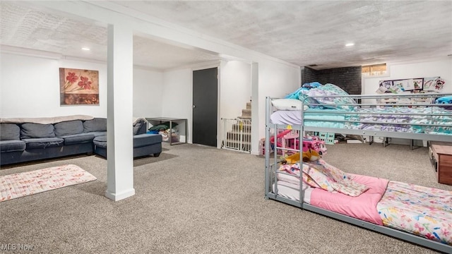 bedroom featuring carpet and a textured ceiling