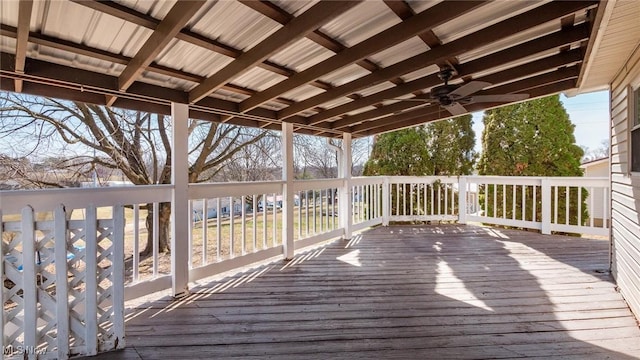 wooden deck featuring ceiling fan