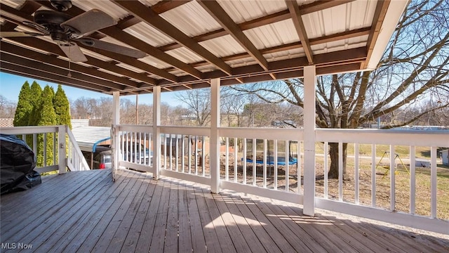 wooden deck with a ceiling fan