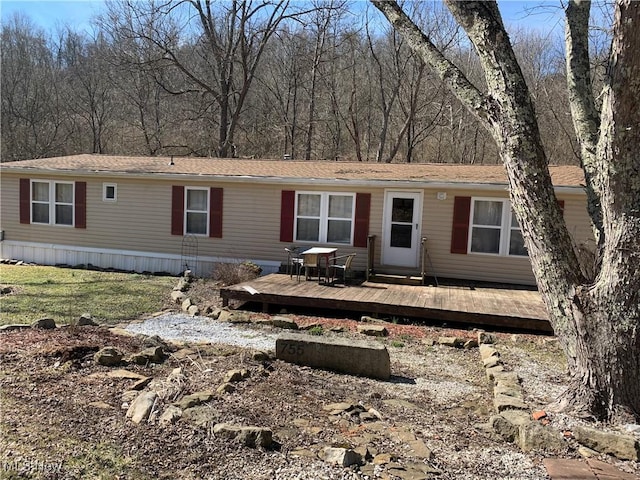 view of front of house featuring a wooden deck