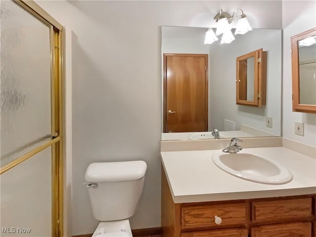 bathroom with toilet and vanity