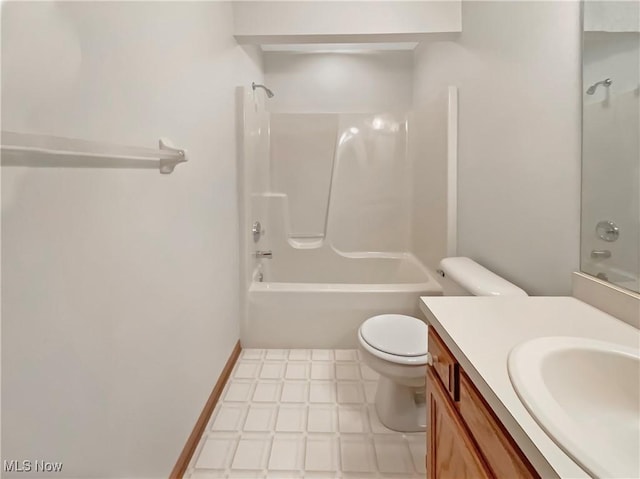 full bath featuring tile patterned floors, toilet, baseboards, bathing tub / shower combination, and vanity