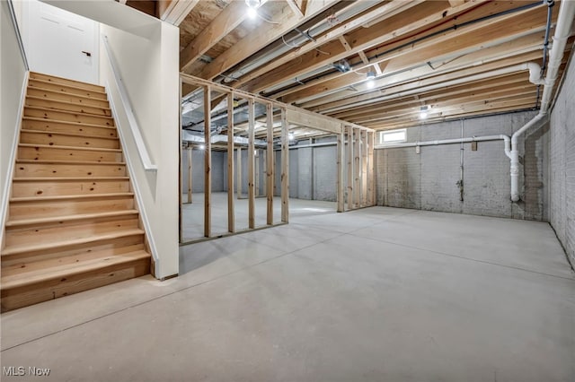 basement featuring stairs