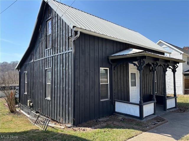 view of side of property featuring metal roof