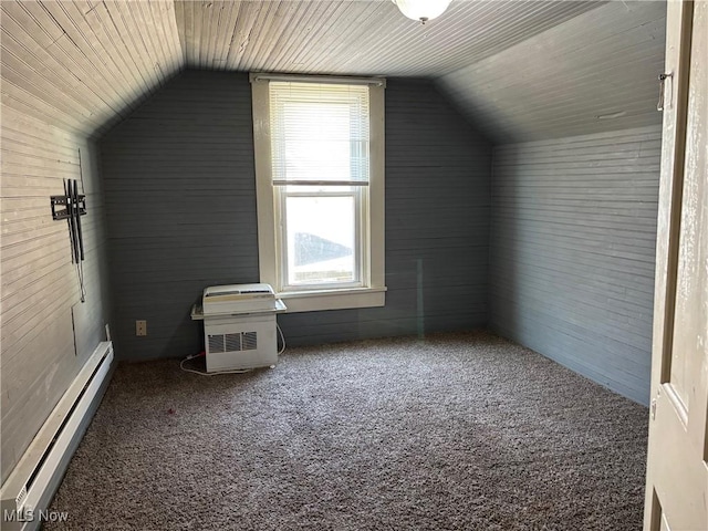 bonus room featuring a baseboard radiator, carpet floors, and vaulted ceiling