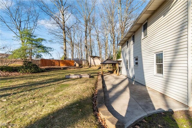 view of yard with a gazebo, a patio, and fence