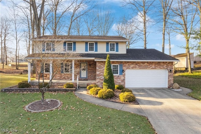 view of front of home featuring brick siding, a front lawn, a porch, driveway, and an attached garage