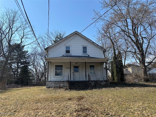 view of front facade with a porch and a front lawn