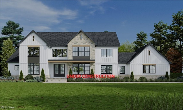 modern farmhouse style home featuring board and batten siding, a front lawn, french doors, and roof with shingles