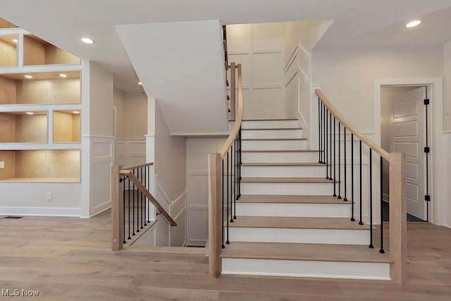 2678 Rocky Ridge Dr, Westlake, OH 44145 - stairs featuring a decorative wall, recessed lighting, wood finished floors, and visible vents