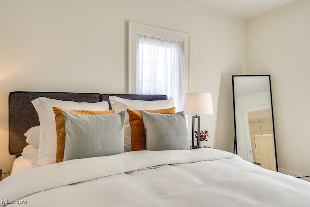 bedroom with ornamental molding