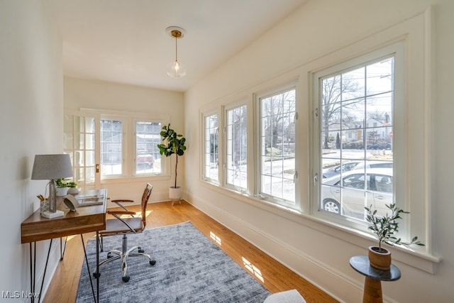 office area with wood finished floors and baseboards