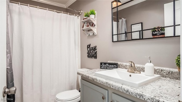 full bathroom with crown molding, toilet, and vanity