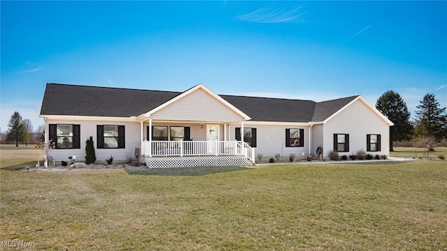 ranch-style house featuring a porch, a front yard, and a shingled roof