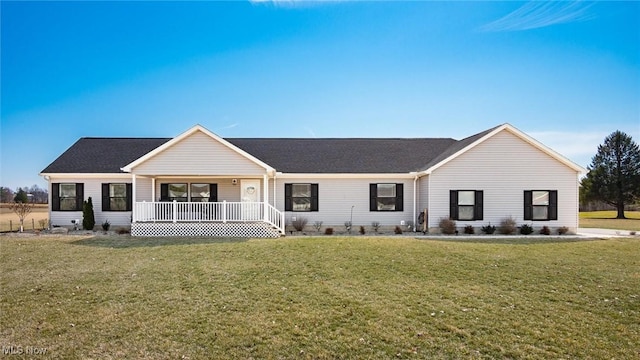 ranch-style house with covered porch, a shingled roof, and a front lawn